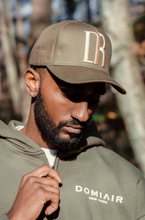 Load image into Gallery viewer, DR Monogram Trucker Hat Olive
